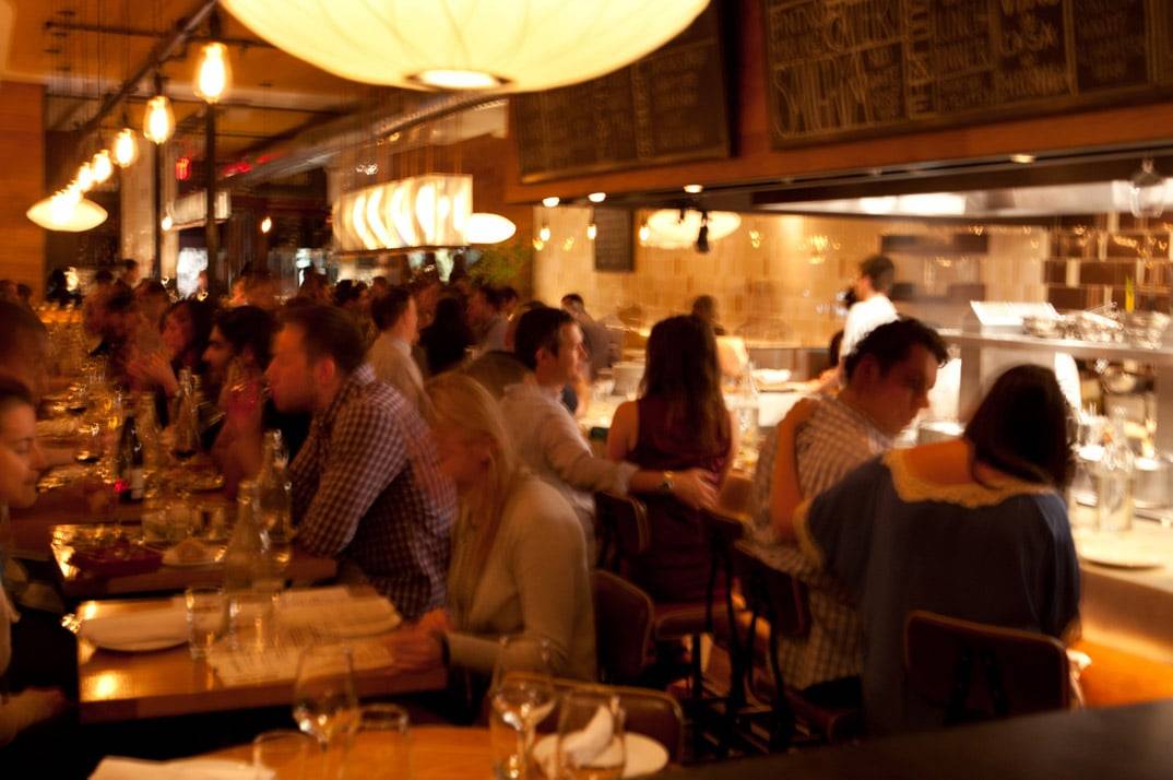 Inside Boqueria: the open kitchen and bar that anchor the Colony Square room